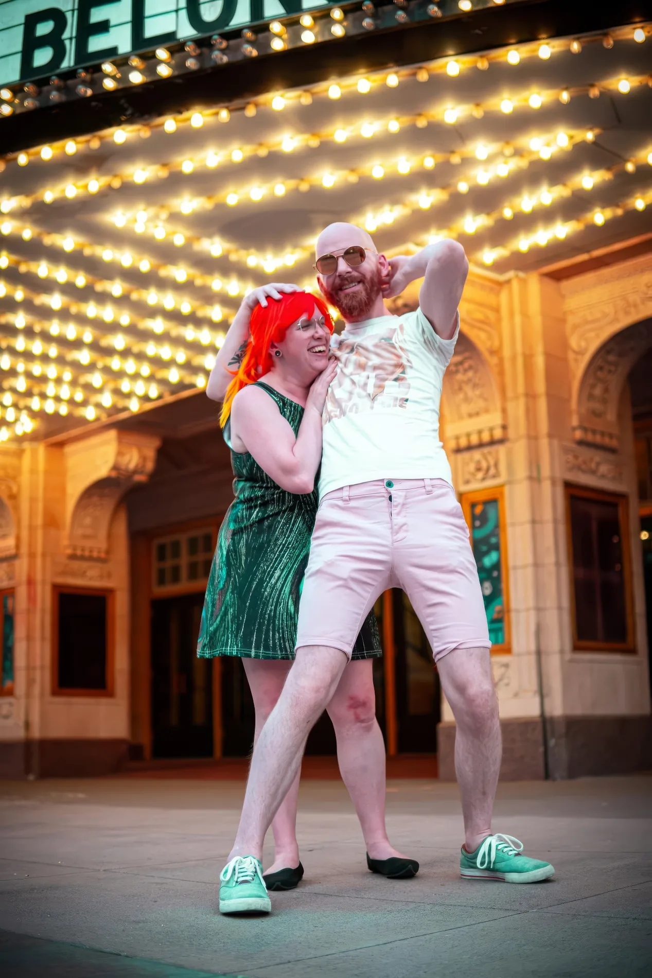 Candid wedding photography Charleston, a couple dancing under marquee lights, by Bryan Korth